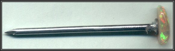 Opal glued to nail with GOOP